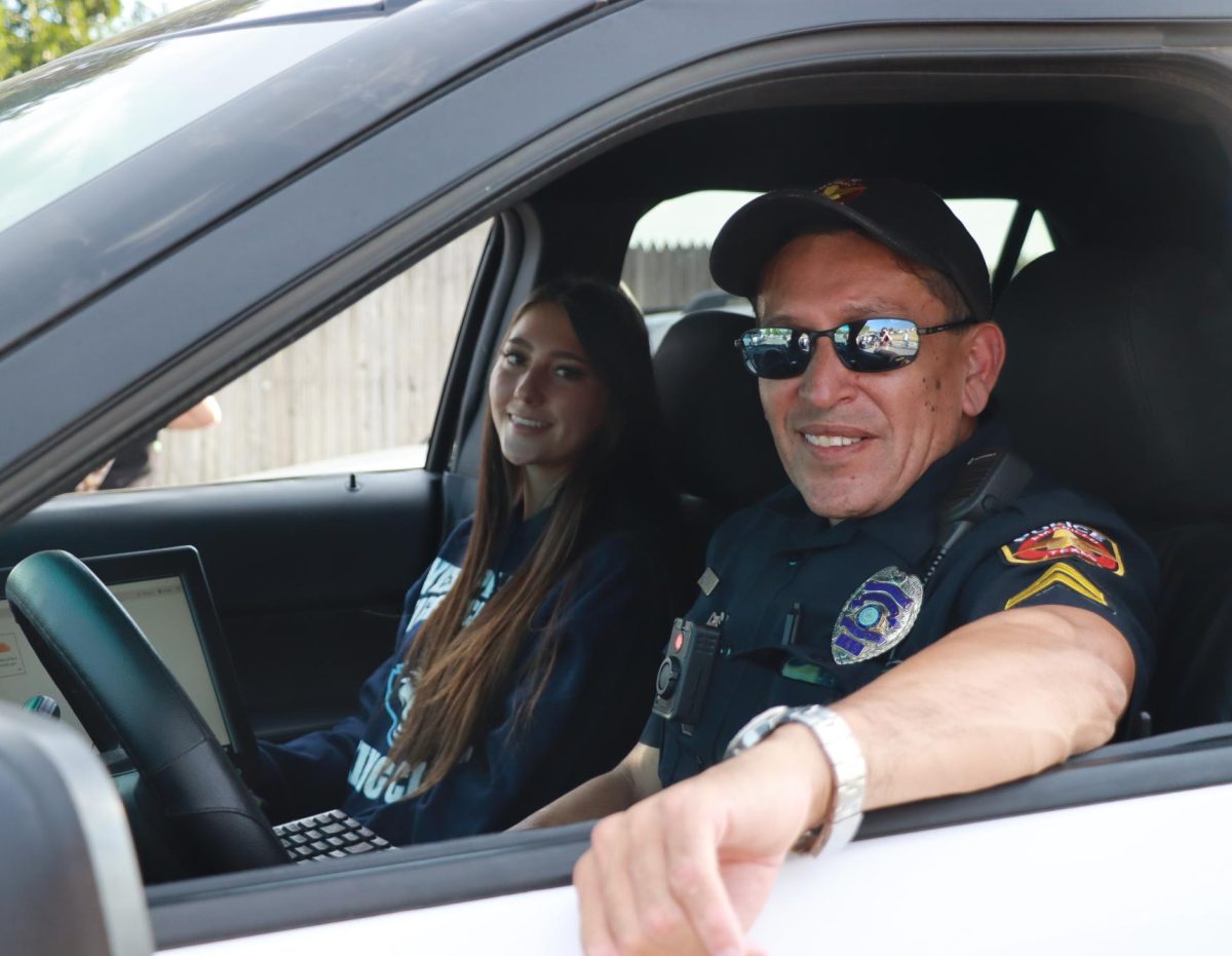 Driving through the homecoming parade, Officer Gutierrez shows his safe driving skills. 