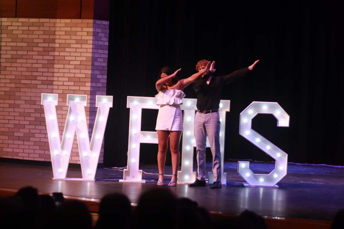 Posing for a photo at the senior Mosts ceremony, the winners of the “Most Witty” award, Vanessa Baca (12) and Luke Blackwell (12), leave their mark on West Plains.